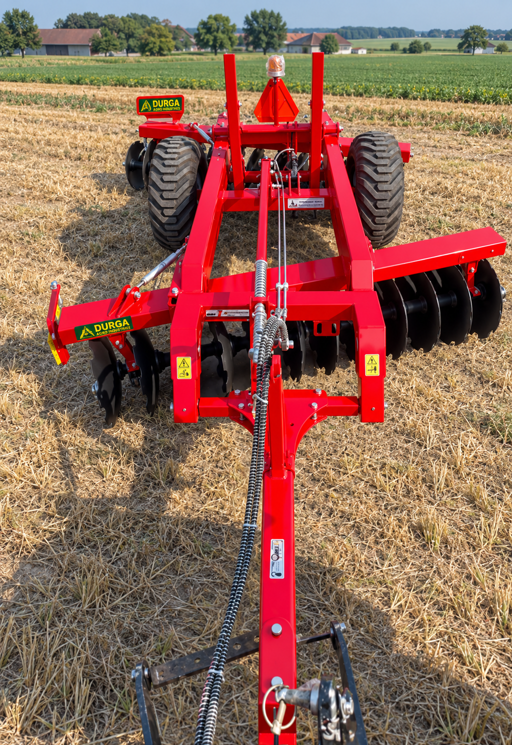 12x12 disc harrow by DURGA AGRO INDUSTRIES in the field